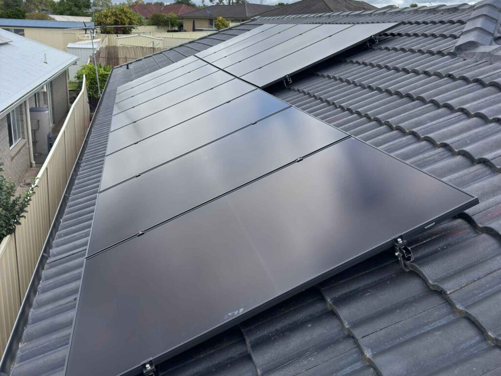 All-black solar panels installed on a tiled roof
