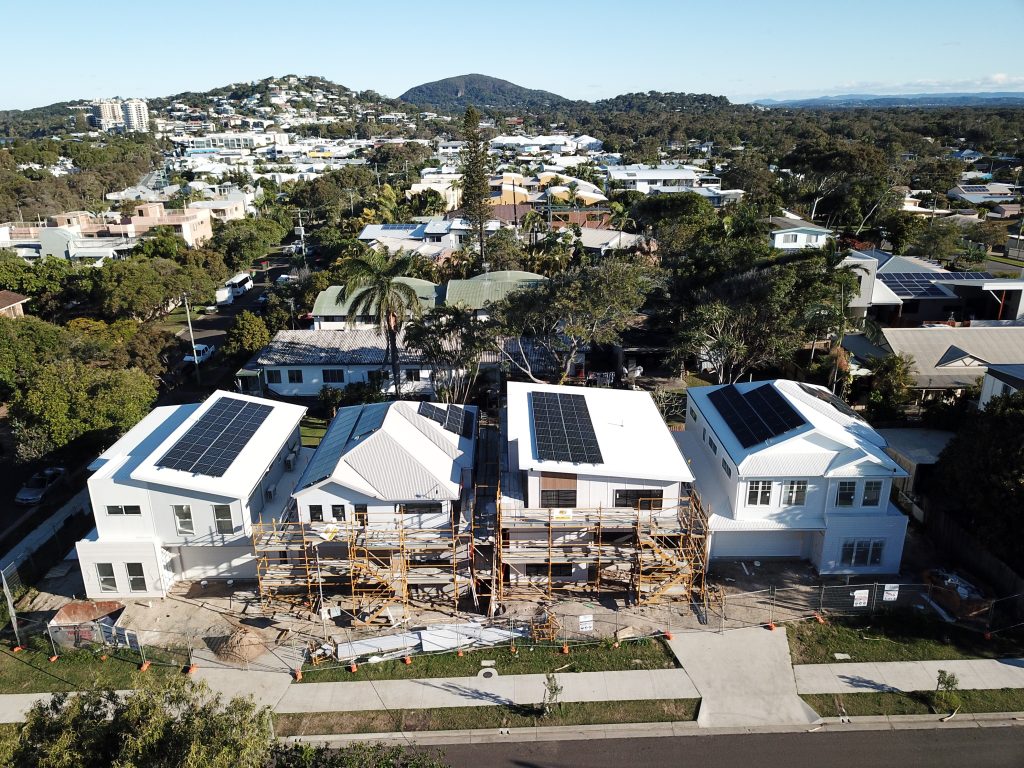 Four Coolum Beach townhouses with rooftop solar installed during construction.