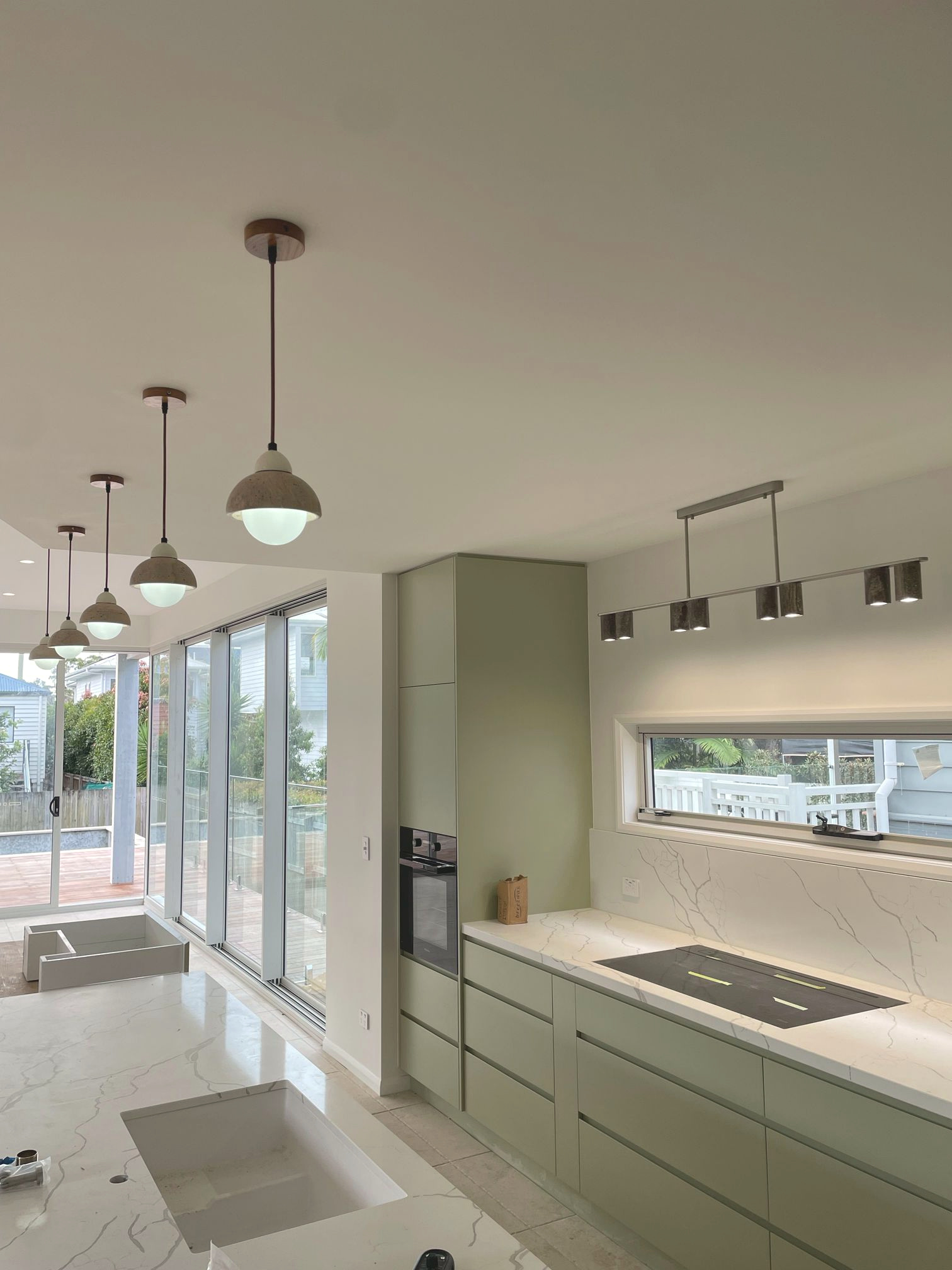 Kitchen lighting and fitted electrical fixtures in the new home.